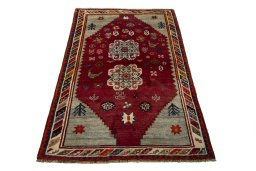 Surface texture of 2000s Persian Gabbeh rug with natural Wool and intricate pattern