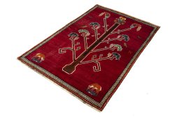 Corner detail of 2000s Persian Gabbeh rug showing border pattern and Wool pile