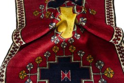Corner detail of 2000s Persian Gabbeh rug showing border pattern and Wool pile
