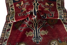 Corner detail of 2000s Persian Gabbeh rug showing border pattern and Wool pile