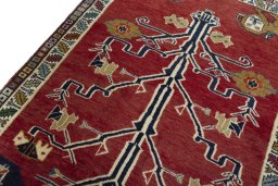 Backside of handmade 2000s Persian Gabbeh rug showing knot structure and weave density