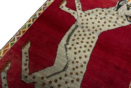 Backside of handmade 2000s Persian Gabbeh rug showing knot structure and weave density