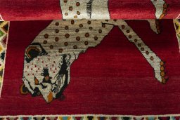 Full view of 2000s Persian Gabbeh rug from Iran / Persia, 178 × 108 cm in Red tones