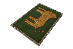 Corner detail of 2000s Persian Gabbeh rug showing border pattern and Wool pile