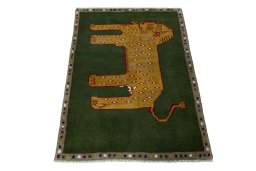 Surface texture of 2000s Persian Gabbeh rug with natural Wool and intricate pattern