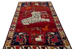 Surface texture of 2000s Persian Gabbeh rug with natural Wool and intricate pattern