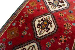 Backside of handmade 2000s Persian Gabbeh rug showing knot structure and weave density