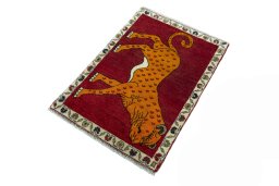 Corner detail of 2000s Persian Gabbeh rug showing border pattern and Wool pile