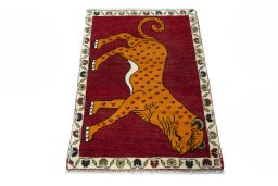 Surface texture of 2000s Persian Gabbeh rug with natural Wool and intricate pattern