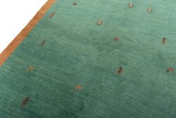 Backside of handmade New Persian Gabbeh rug showing knot structure and weave density