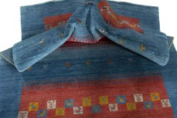 Corner detail of New Persian Gabbeh rug showing border pattern and Wool pile