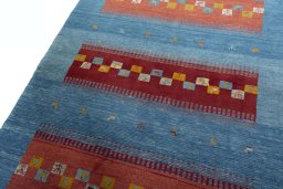 Backside of handmade New Persian Gabbeh rug showing knot structure and weave density