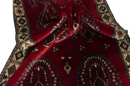Corner detail of 2000s Persian Gabbeh rug showing border pattern and Wool pile