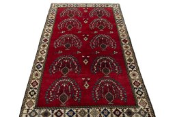 Surface texture of 2000s Persian Gabbeh rug with natural Wool and intricate pattern