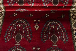 Full view of 2000s Persian Gabbeh rug from Iran / Persia, 252 × 127 cm in Red tones
