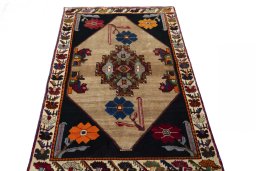 Surface texture of 2000s Persian Gabbeh rug with natural Wool and intricate pattern