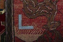 Surface texture of 2000s Persian Gabbeh rug with natural Wool and intricate pattern