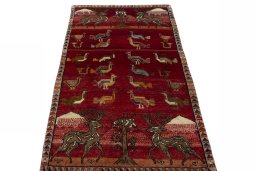 Surface texture of 2000s Persian Gabbeh rug with natural Wool and intricate pattern