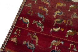 Backside of handmade 2000s Persian Gabbeh rug showing knot structure and weave density
