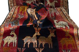 Corner detail of 2000s Persian Gabbeh rug showing border pattern and Wool pile