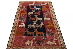 Surface texture of 2000s Persian Gabbeh rug with natural Wool and intricate pattern