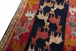 Backside of handmade 2000s Persian Gabbeh rug showing knot structure and weave density