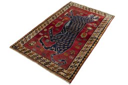 Corner detail of 2000s Persian Gabbeh rug showing border pattern and Wool pile