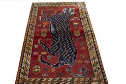 Surface texture of 2000s Persian Gabbeh rug with natural Wool and intricate pattern