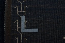 Surface texture of 2000s Persian Gabbeh rug with natural Wool and intricate pattern