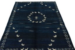 Surface texture of 2000s Persian Gabbeh rug with natural Wool and intricate pattern