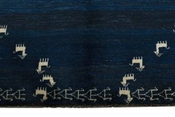 Close-up detail of 2000s Persian Gabbeh rug from Iran / Persia showing Wool weave