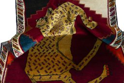 Corner detail of 2000s Persian Gabbeh rug showing border pattern and Wool pile