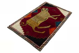 Corner detail of 2000s Persian Gabbeh rug showing border pattern and Wool pile