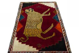 Surface texture of 2000s Persian Gabbeh rug with natural Wool and intricate pattern