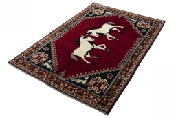 Corner detail of 2000s Persian Gabbeh rug showing border pattern and Wool pile