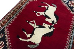 Backside of handmade 2000s Persian Gabbeh rug showing knot structure and weave density