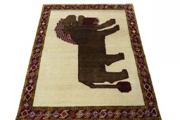 Surface texture of 2000s Persian Gabbeh rug with natural Wool and intricate pattern