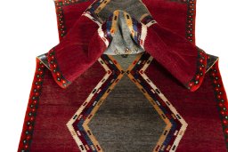 Corner detail of 2000s Persian Gabbeh rug showing border pattern and Wool pile