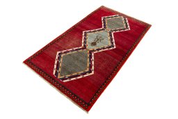 Corner detail of 2000s Persian Gabbeh rug showing border pattern and Wool pile