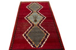 Surface texture of 2000s Persian Gabbeh rug with natural Wool and intricate pattern