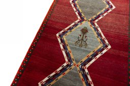 Backside of handmade 2000s Persian Gabbeh rug showing knot structure and weave density