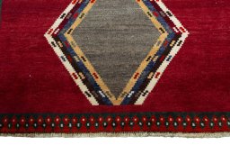 Central medallion detail of 2000s Persian Gabbeh rug from Iran / Persia