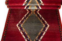 Full view of 2000s Persian Gabbeh rug from Iran / Persia, 208 × 116 cm in Red tones