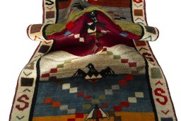 Corner detail of 2000s Persian Gabbeh rug showing border pattern and Wool pile