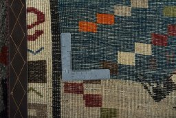 Close-up detail of 2000s Persian Gabbeh rug from Iran / Persia showing Wool weave