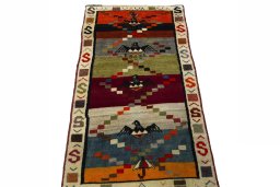 Surface texture of 2000s Persian Gabbeh rug with natural Wool and intricate pattern