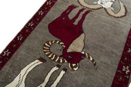 Backside of handmade 2000s Persian Gabbeh rug showing knot structure and weave density