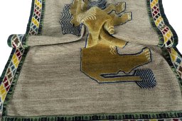 Corner detail of 2000s Persian Gabbeh rug showing border pattern and Wool pile