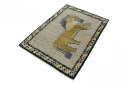 Corner detail of 2000s Persian Gabbeh rug showing border pattern and Wool pile