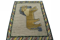 Surface texture of 2000s Persian Gabbeh rug with natural Wool and intricate pattern